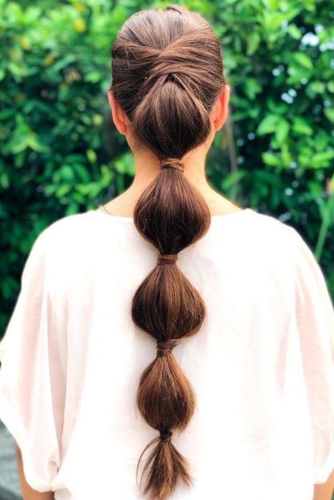 Bubble ponytail with playful shape.