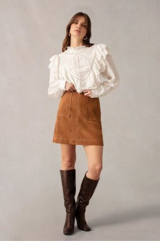 Lace blouse and suede skirt cowgirl outfit.