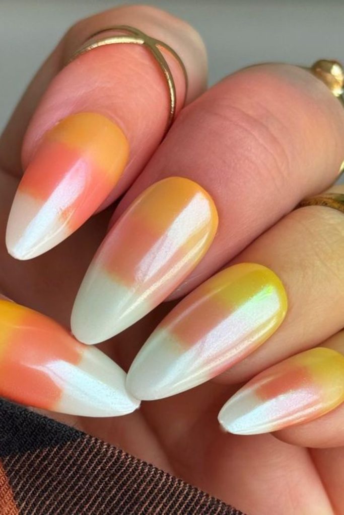 Candy corn gradient festive nail colors.