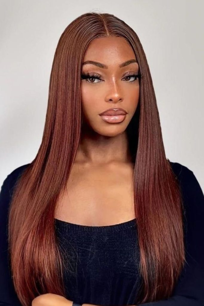 Cinnamon brown straight satin hair look.