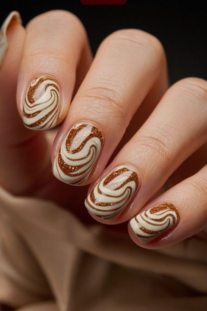 Glossy cinnamon swirl autumn manicure
