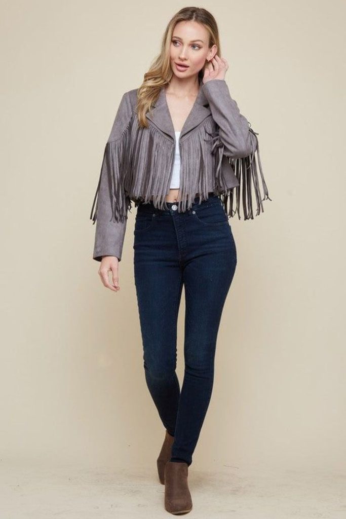 Silver fringe jacket with tight jeans.