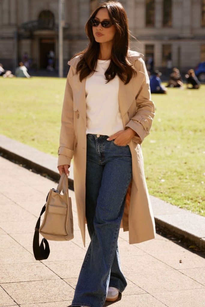 Ivory tee and camel trench pairing.