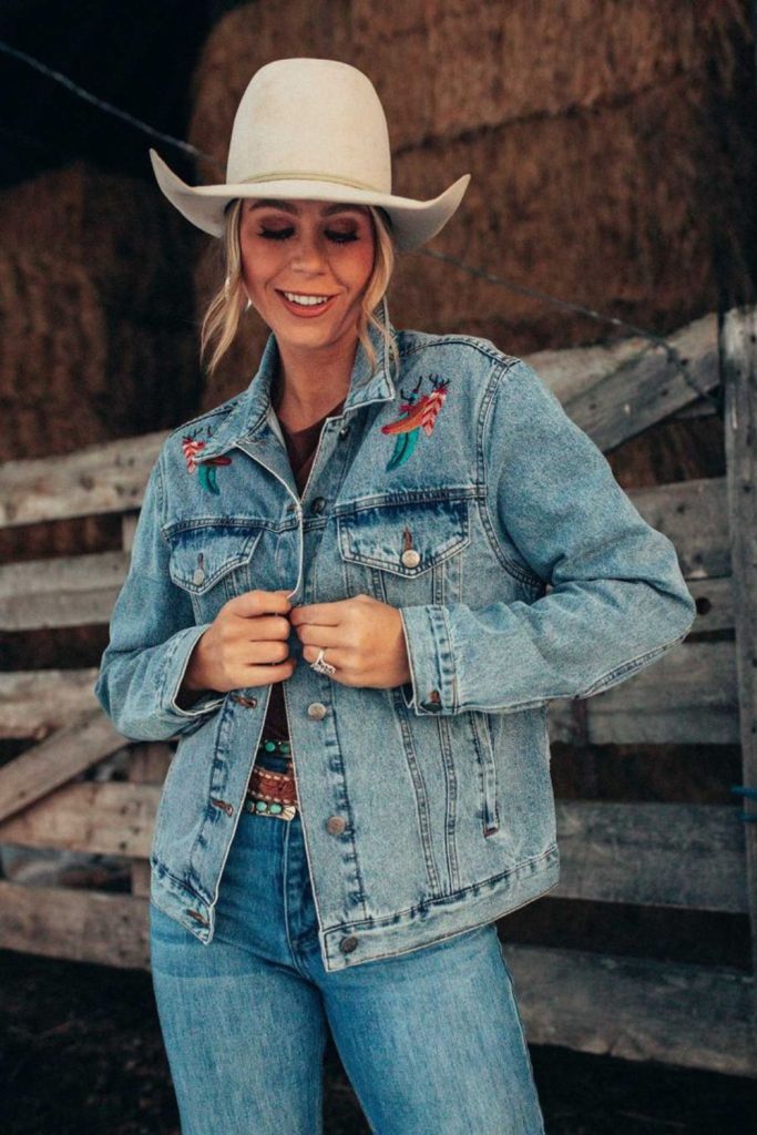 Embroidered denim jacket and flared pants.