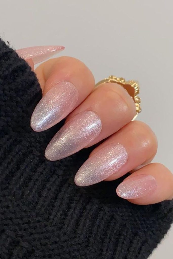 Frosted pink nails with icy shimmer.