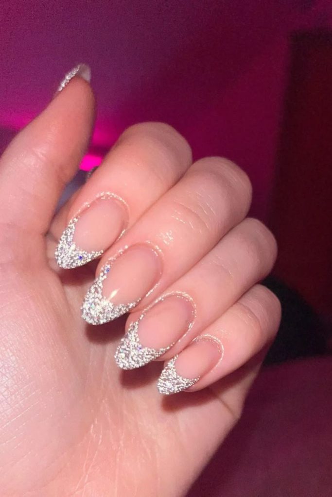 Frosted silver French tip nails.