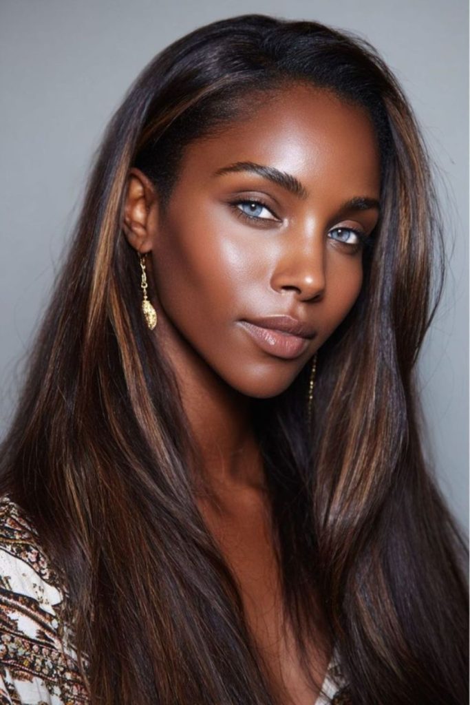 Golden straight sleek hair glowing beauty.