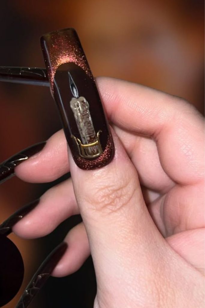 Grave candle glowing vigil nail art.