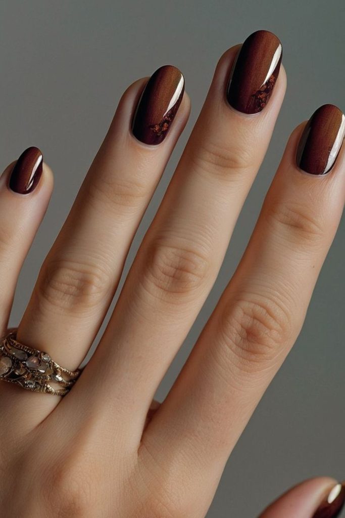 Hazel gold misty glow nails.