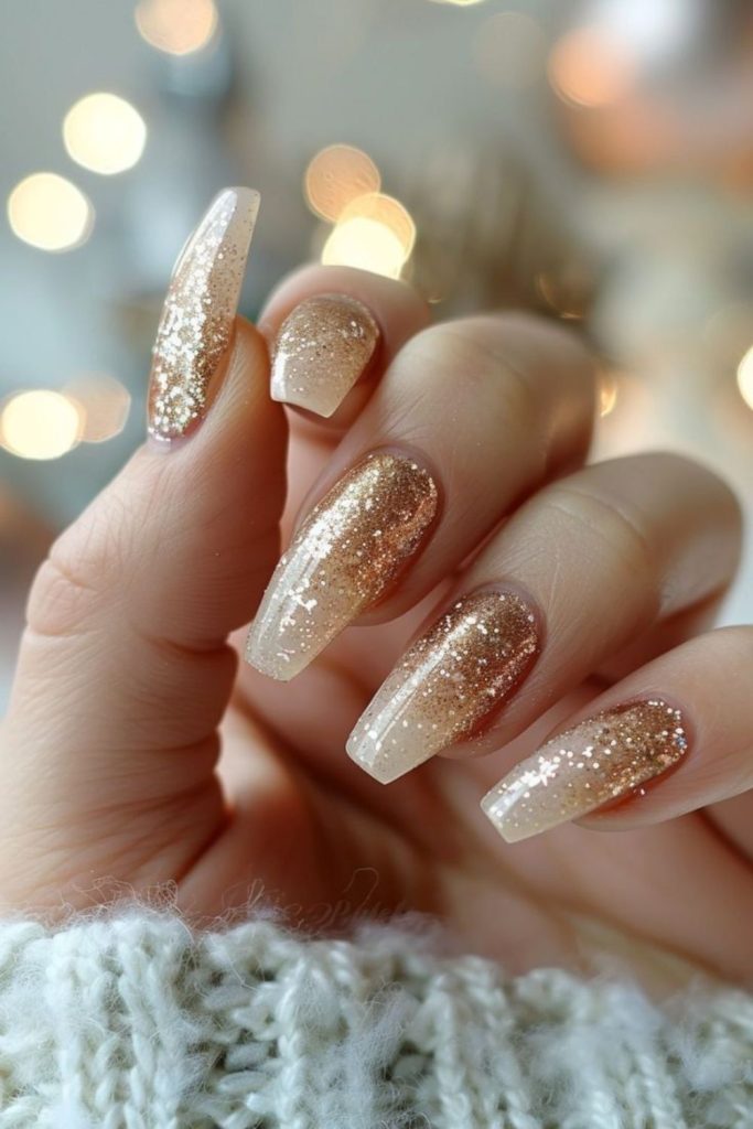 Champagne gold glitter ombre nails.