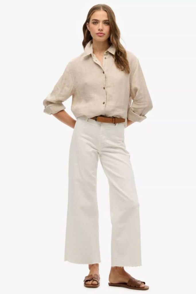 Relaxed linen shirt and neutral pants.
