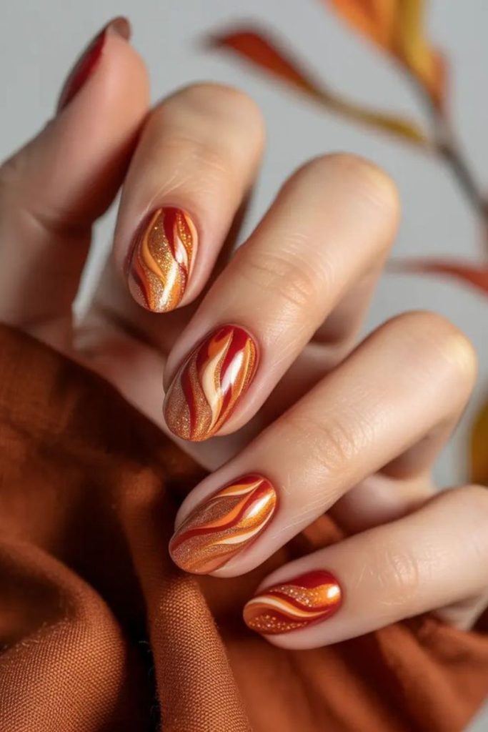 Burnt orange maple glaze nail art.