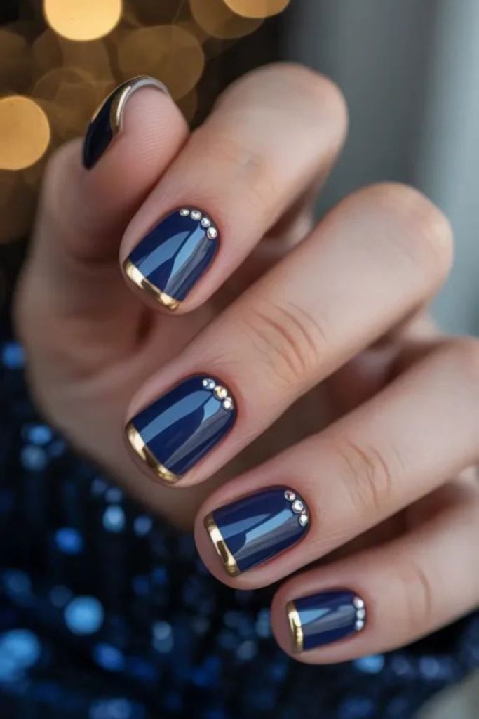 Midnight navy gold ribbon nails.