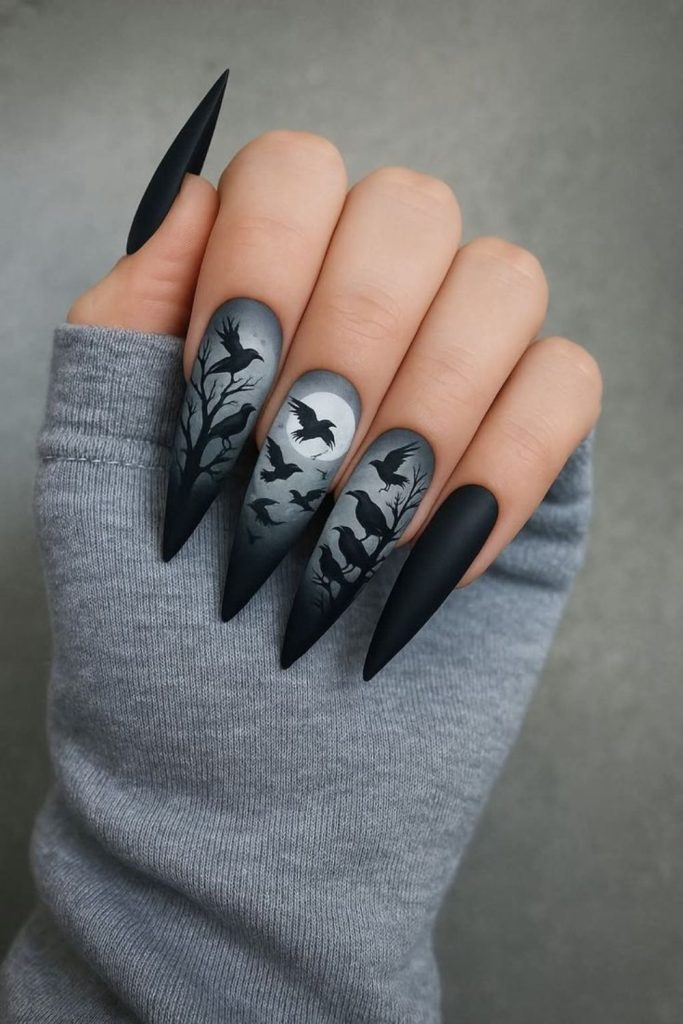 Midnight raven feather inspired nail design.