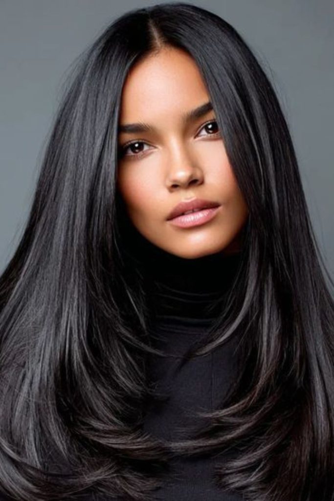 Mirror-shine straight black hairstyle.
