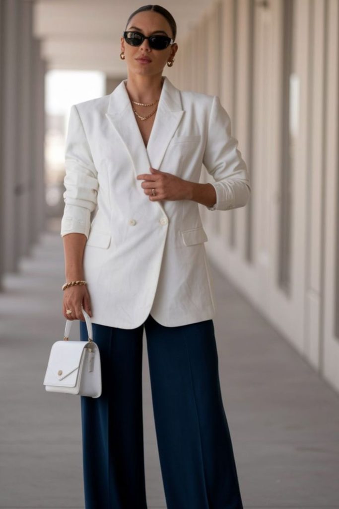 Blue wide-leg pants and white blazer.