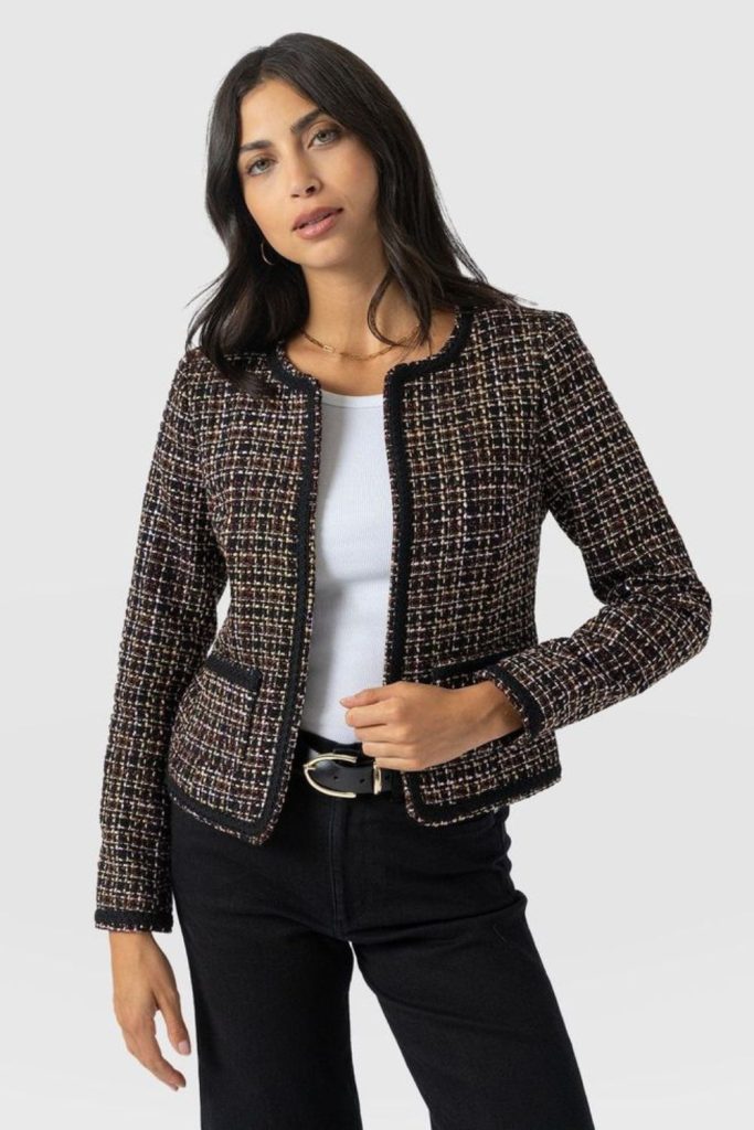 Tweed blazer and white shirt chic.