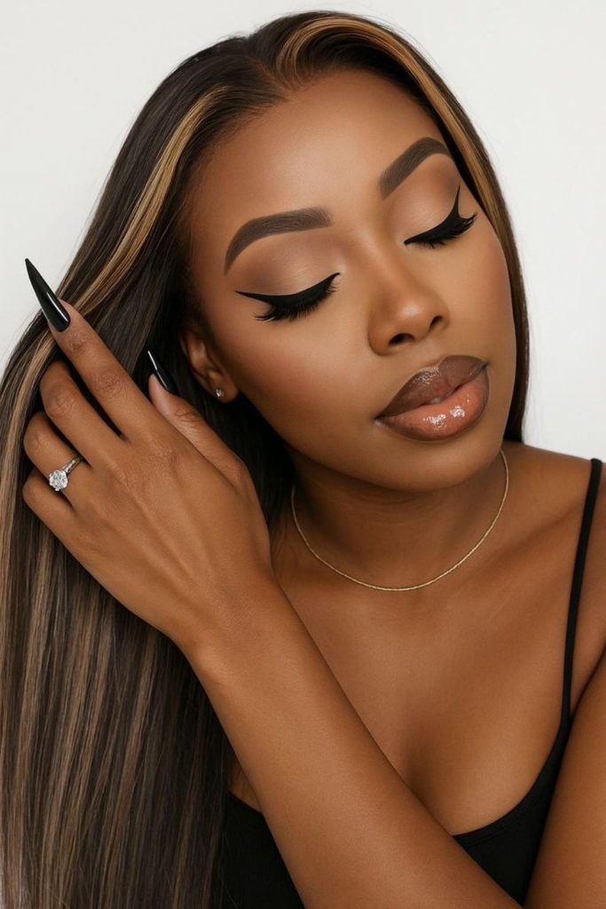 Caramel sleek straight hairstyle warm tone.