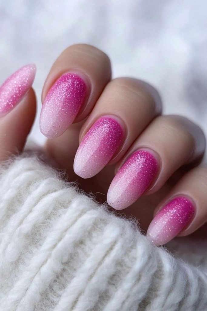 Ornament-inspired pink glitter nails.