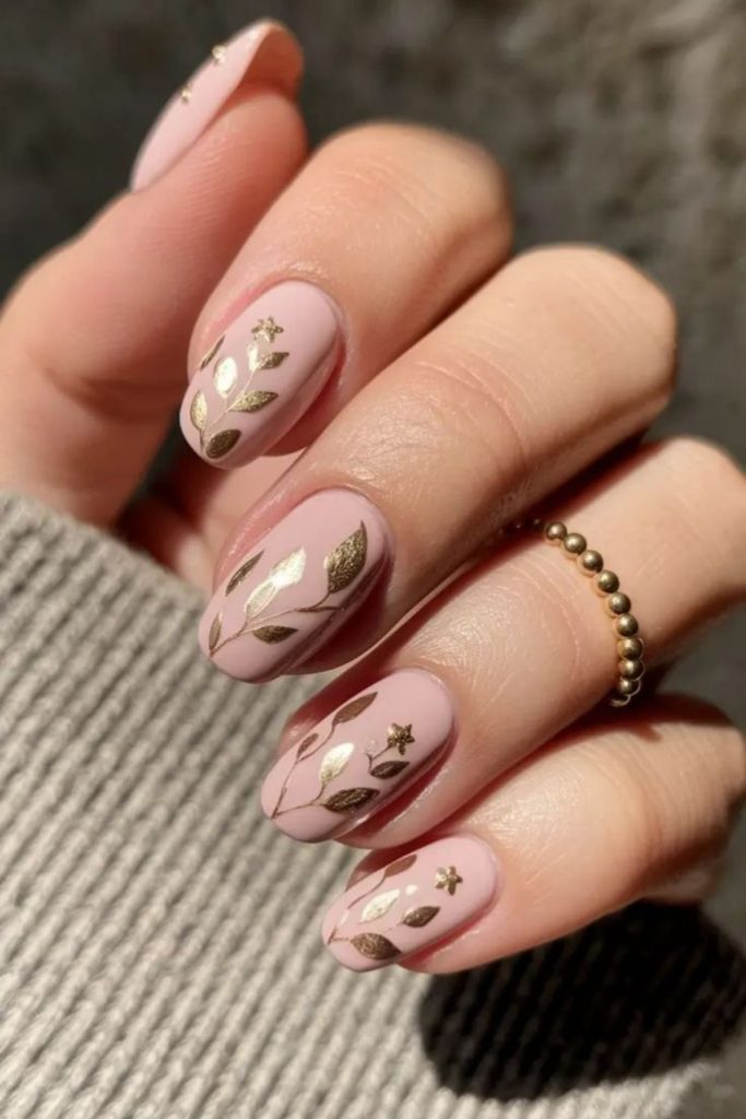Velvet pink nails with gold foil.