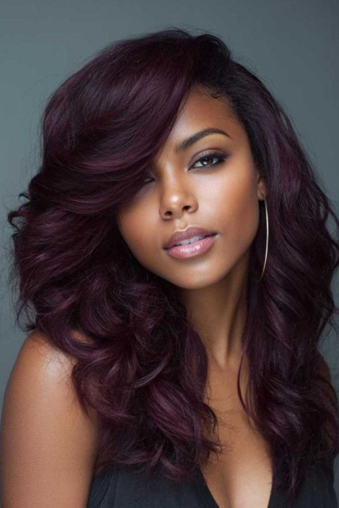 Plum layered coils glowing with depth.