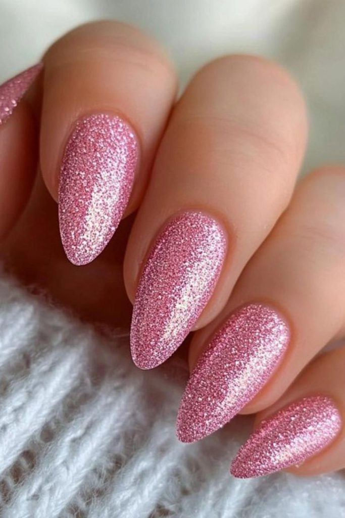 Rose shimmer nails with halo sparkle.