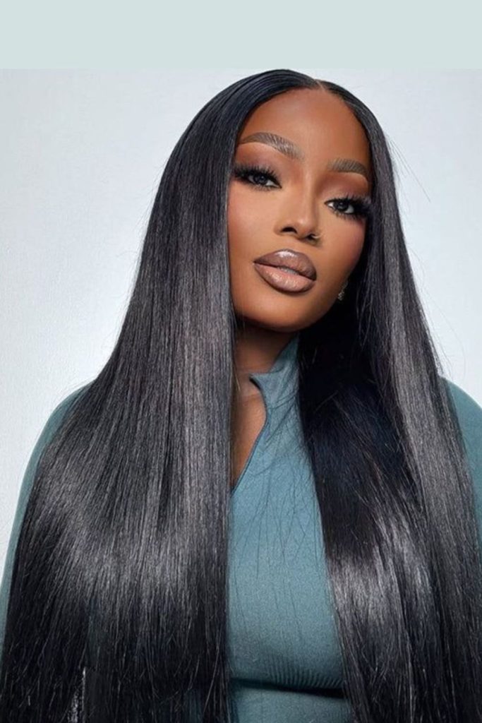 Satin-soft sleek dark hairstyle.