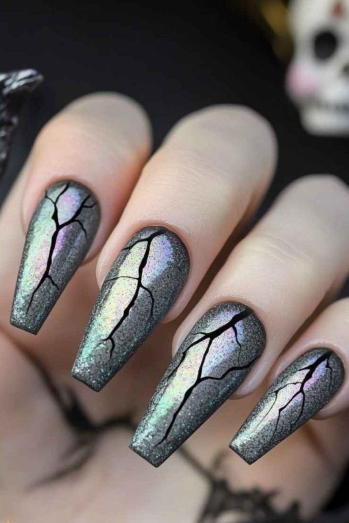 Shattered glass cracked horror nail design.