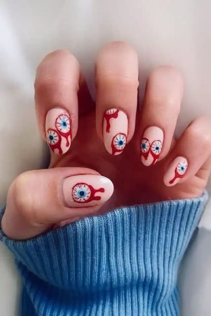 Sinister eyeball creepy staring nail design.