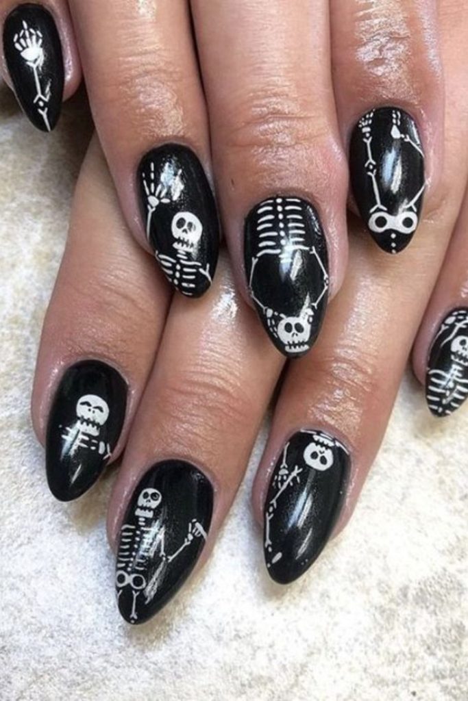 Skeleton dance quirky spooky nail art.
