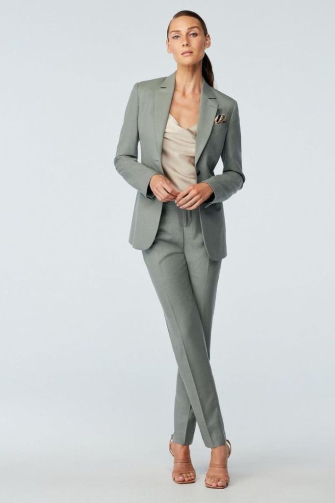 Gray suit with pink camisole elegance.
