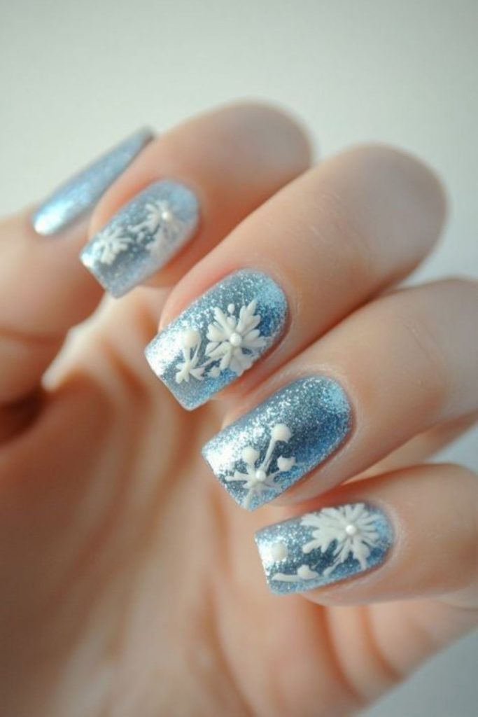 Blue snowflake frosty holiday nails.