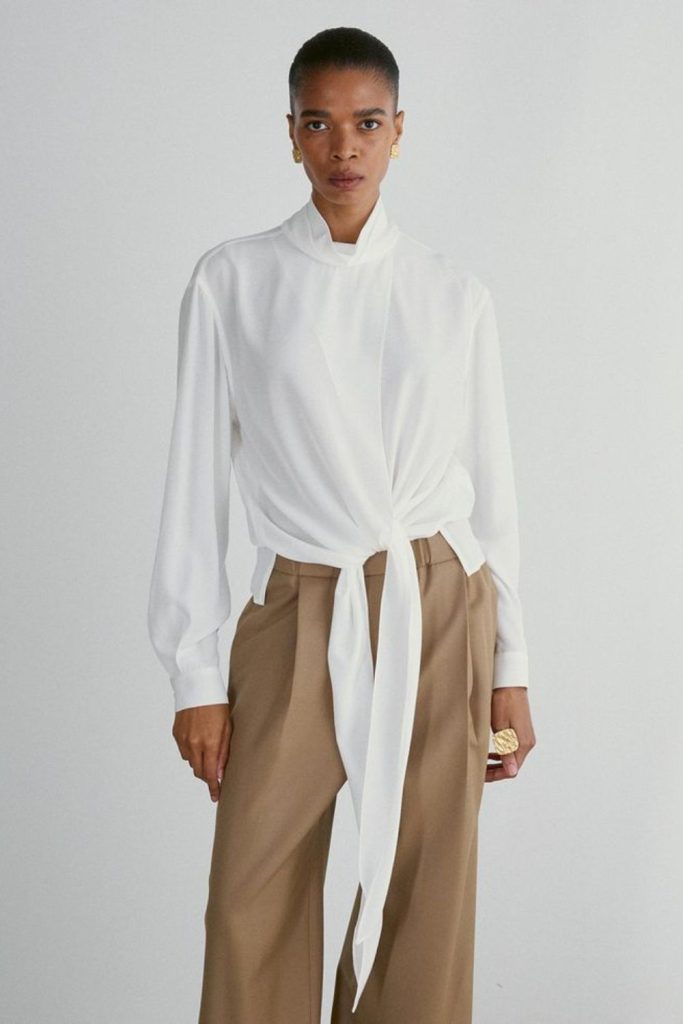 Cream wrap blouse and amber trouser.