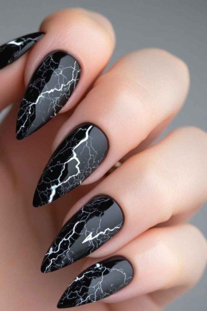 Stormy night sky lightning nail art.