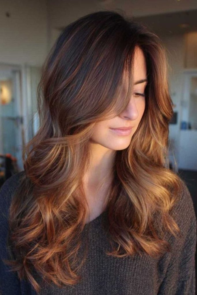Toffee brown hair with ember hues.