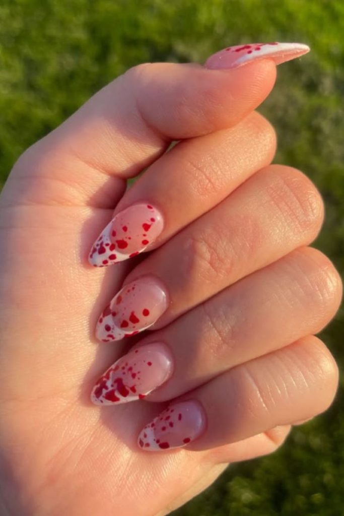 Vampire bite subtle blood nail art.