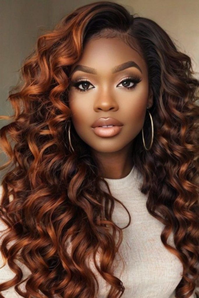 Chestnut wand curls reflecting soft light.