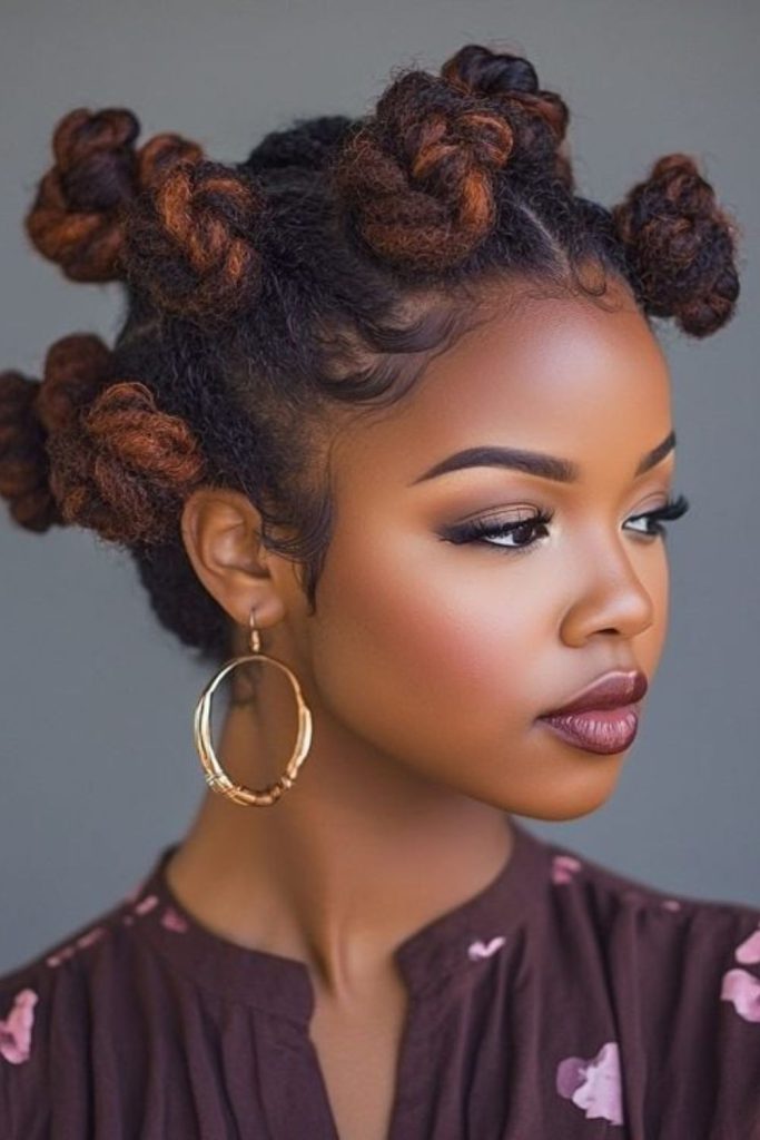 Bantu knots creating sculpted winter crown.