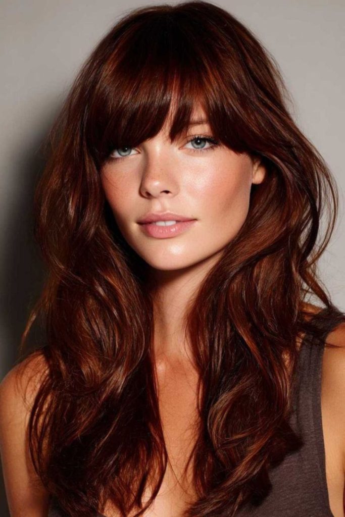Golden-amber flowing side-swept bangs