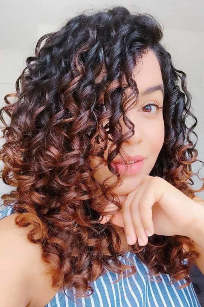 Soft amber curls forming halo