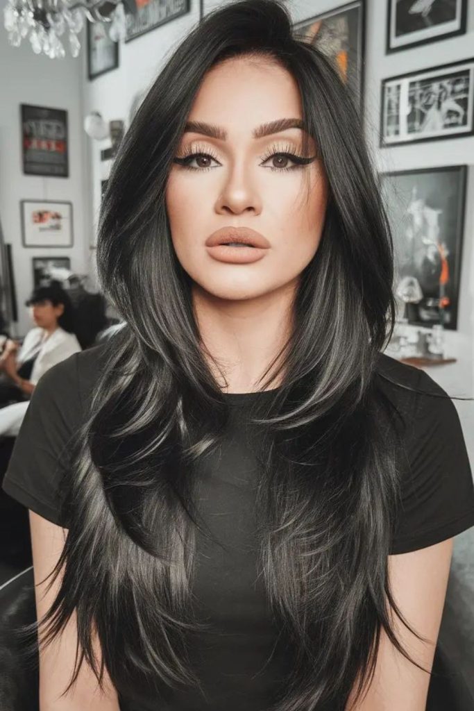 Layered long hair shaping soft contours.