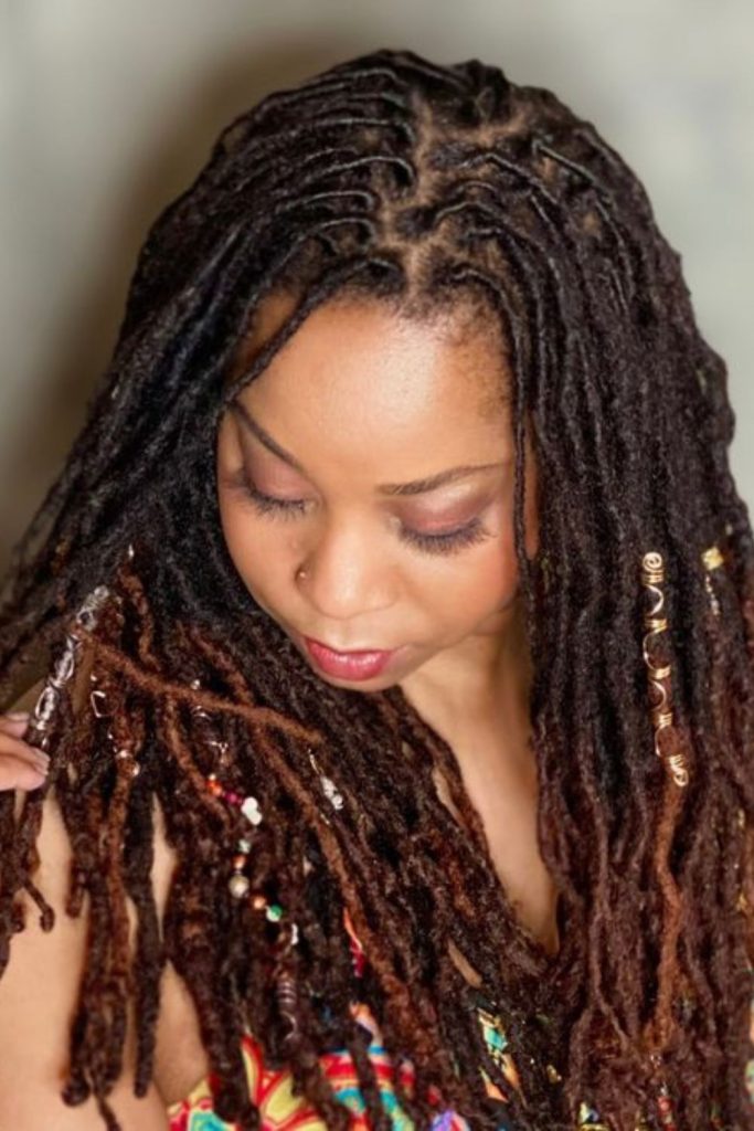 Copper-brown locs drifting like autumn leaves