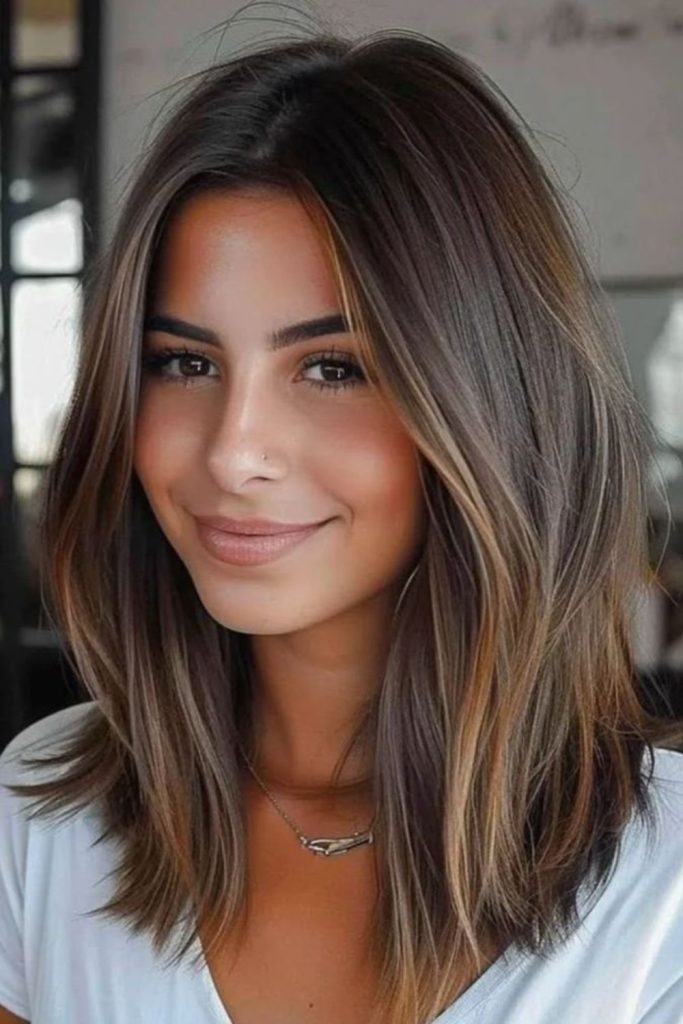 Sun-kissed bronzed bob with layered movement.