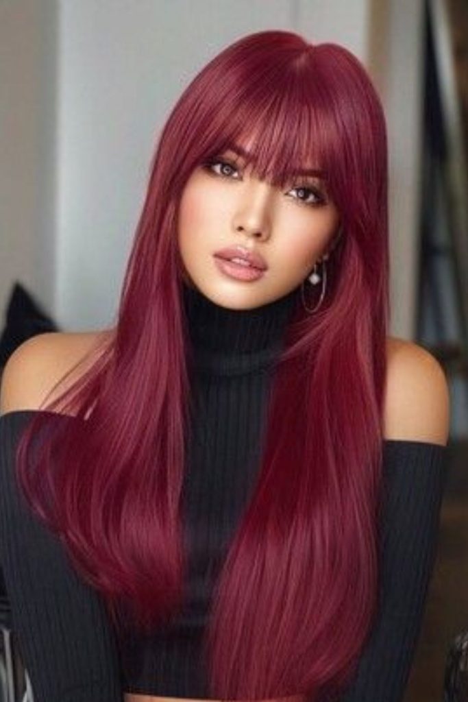 Bold red wispy curtain bangs