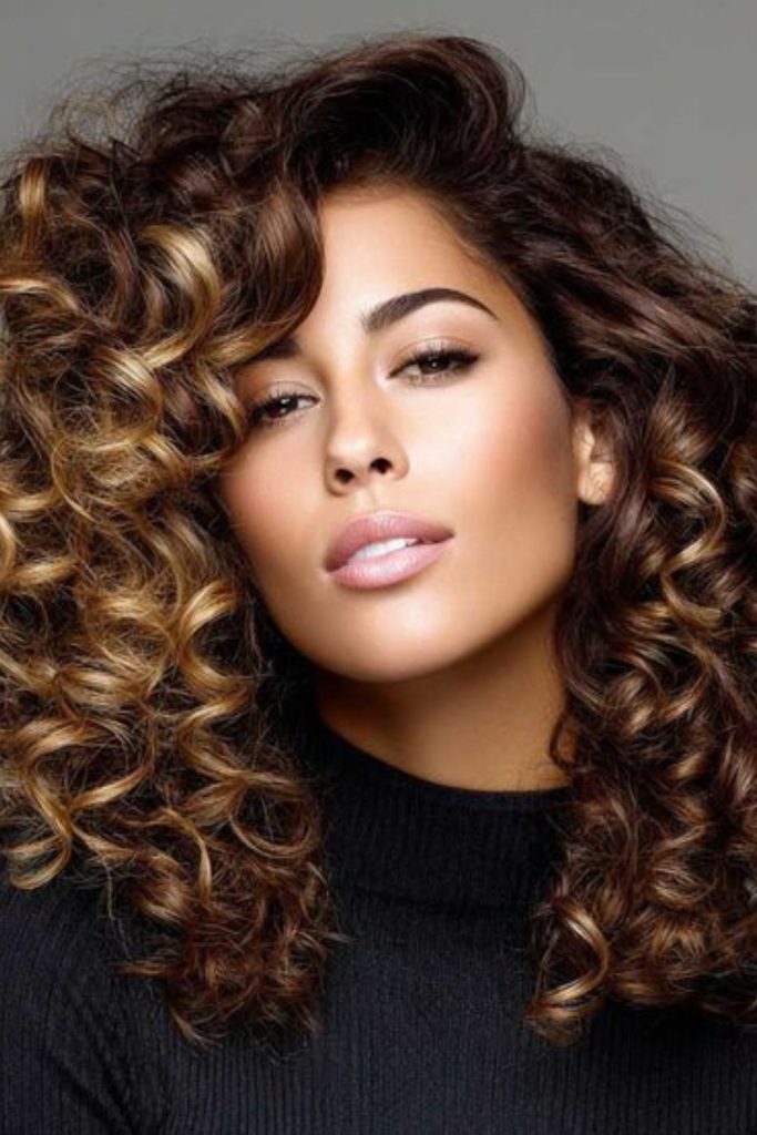 Shoulder-length curls floating softly