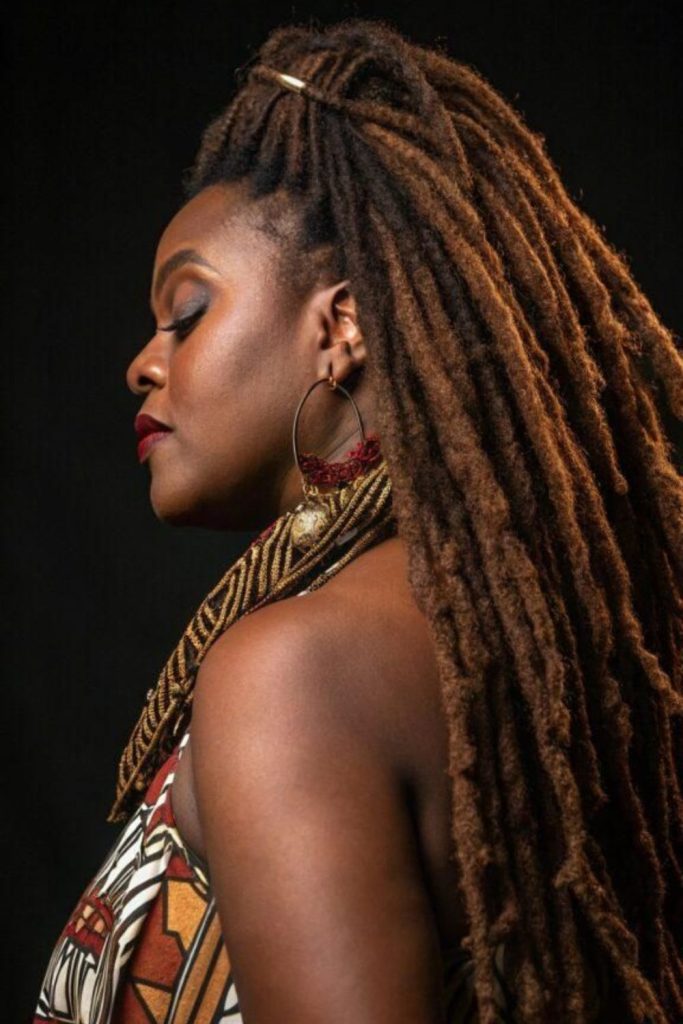 Rich black locs cascading over shoulders