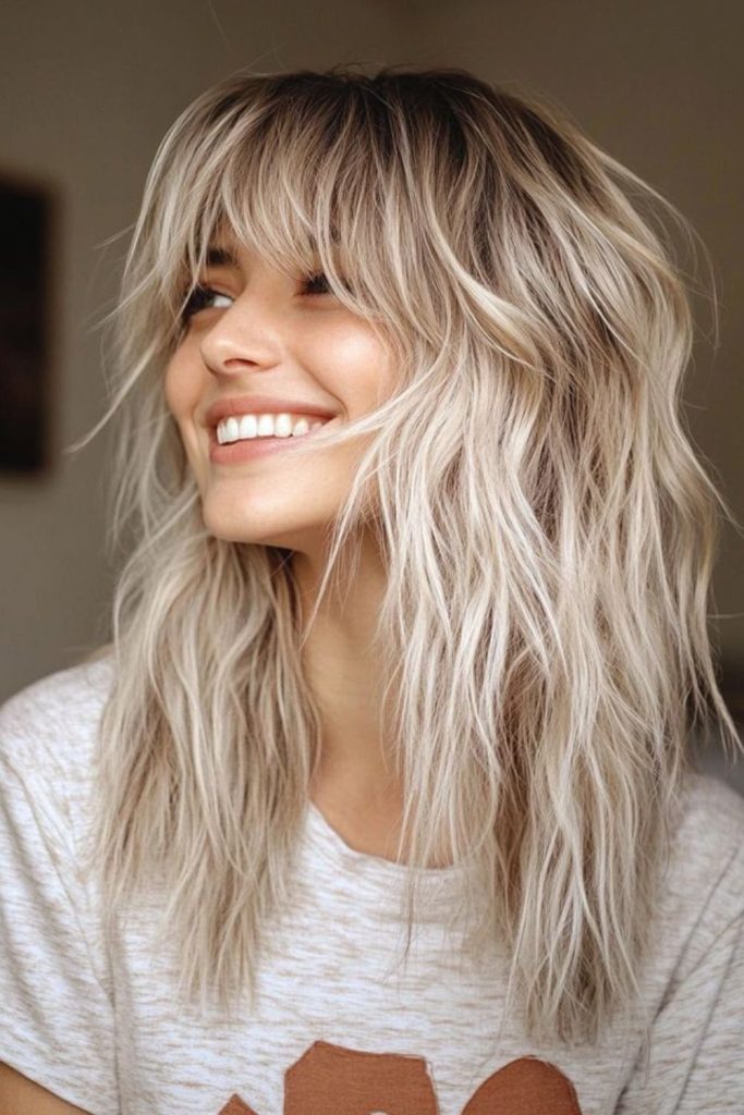 Airy layers create light textured hairstyle.