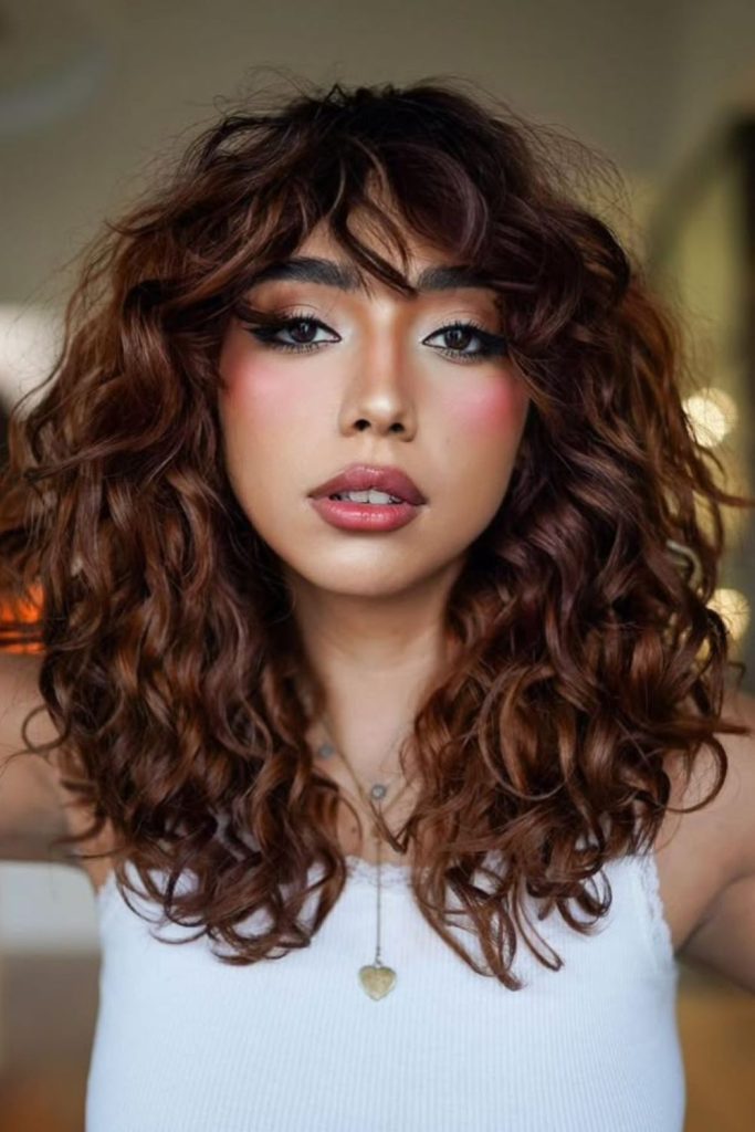 Layered curls forming flame-like shape
