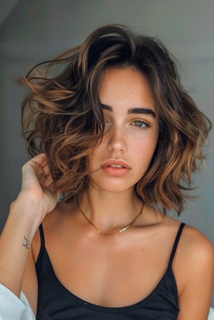 Playful curly bob with light movement.