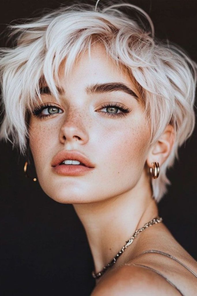 Cool toned pixie with soft sweep.